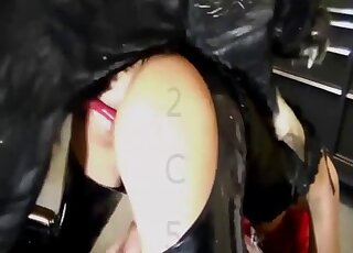 Leather-wearing beauty gets banged from behind